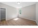 Bedroom featuring wood floors, neutral walls, and a bright window at 120 Hatchet Creek Ct Ct, Morrisville, NC 27560
