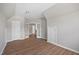 Bonus room showcasing french doors, neutral walls, wood flooring, and dormer ceilings at 120 Hatchet Creek Ct Ct, Morrisville, NC 27560