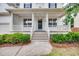 Inviting front porch with classic white columns and wood railing, perfect for relaxing at 120 Hatchet Creek Ct Ct, Morrisville, NC 27560