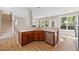 Modern kitchen with stainless steel appliances, wood cabinets and light stone countertops at 120 Hatchet Creek Ct Ct, Morrisville, NC 27560