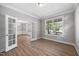 Bright living room featuring stylish floors and a view into an elegant dining area at 120 Hatchet Creek Ct Ct, Morrisville, NC 27560
