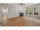 Living room with modern flooring, a cozy fireplace, and ample natural light at 120 Hatchet Creek Ct Ct, Morrisville, NC 27560