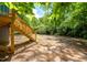 Exterior shot shows a home's backyard with a staircase leading to a home at 1402 Robinhood Rd, Durham, NC 27701