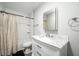 Bright bathroom features subway tile in the shower and vanity with a marble countertop at 1402 Robinhood Rd, Durham, NC 27701