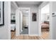 Hallway view showcasing access to bedrooms and a modern bathroom with tiled flooring at 1402 Robinhood Rd, Durham, NC 27701