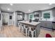 Modern eat-in kitchen boasts stainless steel appliances and butcher block island with bar stool seating at 1402 Robinhood Rd, Durham, NC 27701