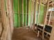 Bathroom under construction, featuring exposed framing and new plumbing at 1521 1/2 Sunrise Ave, Raleigh, NC 27608