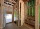 Entryway during construction, showing wooden framing, stairs and visible utility connections at 1521 1/2 Sunrise Ave, Raleigh, NC 27608