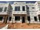 Under construction exterior of new townhome with visible framework and protective wrapping at 1521 1/2 Sunrise Ave, Raleigh, NC 27608