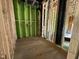 Interior space during construction, featuring visible framing, plumbing, and green sheathing at 1521 1/2 Sunrise Ave, Raleigh, NC 27608