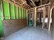 Interior view showcasing wooden frame construction and open space with green sheathing at 1521 1/2 Sunrise Ave, Raleigh, NC 27608