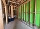 Framed interior construction featuring wooden studs, green sheathing and visible utility connections at 1521 1/2 Sunrise Ave, Raleigh, NC 27608