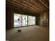 Spacious room under construction featuring large windows with natural light and wood subflooring at 1521 1/2 Sunrise Ave, Raleigh, NC 27608