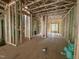 Spacious living room under construction, featuring exposed framing and bright green sheathing at 1521 1/2 Sunrise Ave, Raleigh, NC 27608