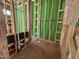 Unfinished bathroom reveals the structural components like wood framing and the installed plumbing system at 1523 Sunrise Ave, Raleigh, NC 27608