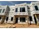 New construction townhome featuring modern architectural details, large windows, and durable weather-resistant wrap at 1523 Sunrise Ave, Raleigh, NC 27608