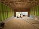 Unfinished garage with stud framing, exterior sheathing, and concrete block foundation at 1523 Sunrise Ave, Raleigh, NC 27608