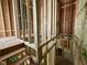Unfinished staircase leading to an upper level of the home, showcases the exposed stud framing and structure at 1523 Sunrise Ave, Raleigh, NC 27608