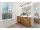 Elegant bathroom with double sink vanity, under cabinet storage, and a large window at 161 Nashua Dr # 2594P, Louisburg, NC 27549