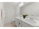 Bright bathroom featuring double sinks, a tub with shower, and neutral tones at 161 Nashua Dr # 2594P, Louisburg, NC 27549