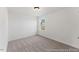 Neutral bedroom with a large window and ceiling light at 161 Nashua Dr # 2594P, Louisburg, NC 27549