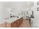 Open kitchen with a large island, stainless steel appliances and white cabinets at 161 Nashua Dr # 2594P, Louisburg, NC 27549