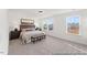 Comfortable main bedroom with two windows, carpet, ceiling fan and stylish furniture at 161 Nashua Dr # 2594P, Louisburg, NC 27549