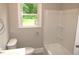 Bathroom featuring a tub and shower combination at 1610 W B St, Butner, NC 27509