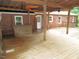 Outdoor living on the wooden deck with exposed-beam cover and ceiling fans at 1610 W B St, Butner, NC 27509
