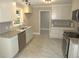 Bright kitchen features stainless steel appliances, granite countertops and subway tile at 1610 W B St, Butner, NC 27509