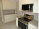Updated kitchen with granite countertops and stainless steel oven at 1610 W B St, Butner, NC 27509