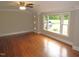 Living room featuring hardwood floors, a large window and decorative molding at 1610 W B St, Butner, NC 27509