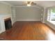 Spacious living room features beautiful hardwood floors and a cozy fireplace at 1610 W B St, Butner, NC 27509