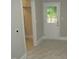 Mudroom with access to the kitchen and backyard at 1610 W B St, Butner, NC 27509