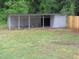 Backyard outbuilding perfect for storage, hobbies, or workshop space with open access on a grassy lot at 1610 W B St, Butner, NC 27509