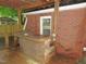 Cozy outdoor bar with wooden countertop and brick exterior, perfect for entertaining guests at 1610 W B St, Butner, NC 27509
