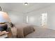 Bedroom featuring plush carpet, neutral colors, and a view into the ensuite bathroom at 169 Nashua Dr # 2590P, Louisburg, NC 27549
