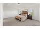 Bright bedroom with neutral tones, carpet floors, and natural light from two windows at 169 Nashua Dr # 2590P, Louisburg, NC 27549