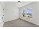 Bedroom with carpeted floors and natural light coming through two large windows at 169 Nashua Dr # 2590P, Louisburg, NC 27549