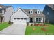 Charming single-Gathering home with a two-car garage and well-manicured lawn at 169 Nashua Dr # 2590P, Louisburg, NC 27549