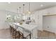 Modern kitchen with white cabinets, quartz countertops, and stainless steel appliances at 169 Nashua Dr # 2590P, Louisburg, NC 27549