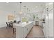 Spacious kitchen with an island, stainless steel appliances, and dining area at 169 Nashua Dr # 2590P, Louisburg, NC 27549