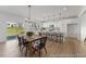 Open-concept kitchen and dining area with modern light fixtures and plenty of natural light at 169 Nashua Dr # 2590P, Louisburg, NC 27549