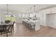Bright, open kitchen featuring a large island with seating and stainless steel appliances at 169 Nashua Dr # 2590P, Louisburg, NC 27549