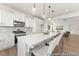 Stylish kitchen featuring a large island with seating and stainless steel appliances at 169 Nashua Dr # 2590P, Louisburg, NC 27549