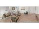 Living room featuring hardwood floors, comfortable seating, and a decorative rug at 169 Nashua Dr # 2590P, Louisburg, NC 27549
