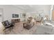 Spacious living room with open floor plan, hardwood floors, and coffered ceilings at 169 Nashua Dr # 2590P, Louisburg, NC 27549