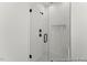 Close up of a modern tiled shower with glass door and built in soap niche at 169 Nashua Dr # 2590P, Louisburg, NC 27549