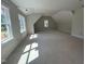 Spacious attic with natural light, peaked ceilings, and multiple windows at 194 Landon Ridge, Sanford, NC 27330