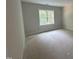 Bedroom with window offering natural light and unfinished flooring, ready for personalization at 194 Landon Ridge, Sanford, NC 27330